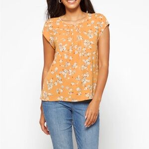 Yellow Macy pleated blouse with button closure at the back neckline.